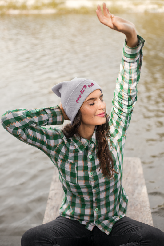 Woman wearing Funky Peacock PowHerFul beanie soaking in the Spring breeze on the lake.